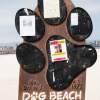 Dog Beach entry sign and message board