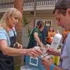 Carol Ladiges doles out some Lighthouse Icecream in the VIP area